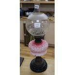 An oil lamp and shade height 59cm