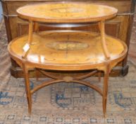 An Edwardian Sheraton style banded and inlaid oval two-tier etagere, on tapered swept supports