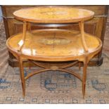 An Edwardian Sheraton style banded and inlaid oval two-tier etagere, on tapered swept supports