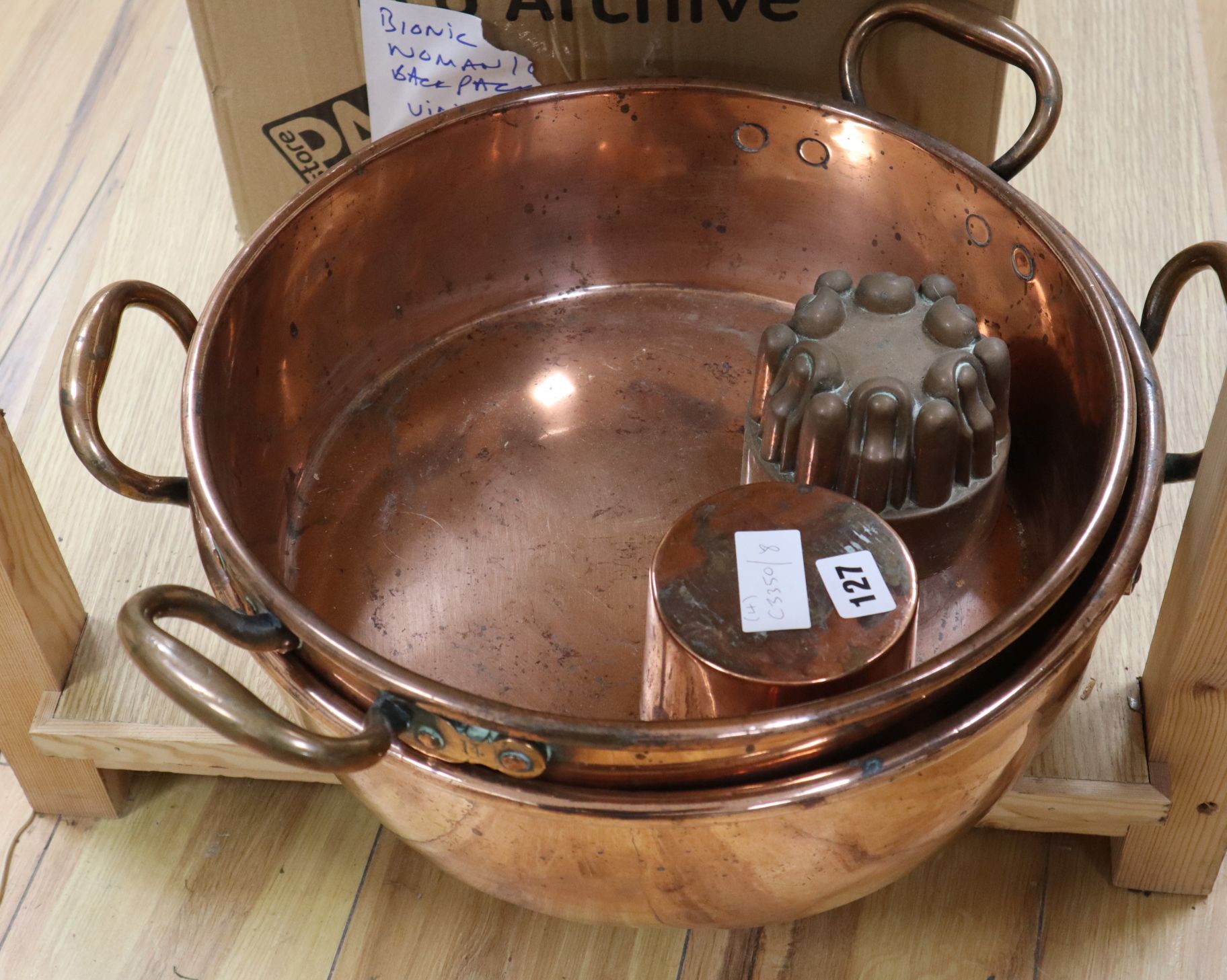 Two Victorian copper jam pans and two copper jelly moulds