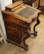 A Victorian walnut inlaid Davenport W.56cm