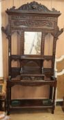 A late Victorian Flemish carved oak hallstand W.134cm