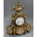 A 19th century Louis XVI style ormolu mantel clock inset with porcelain panels height 38cm