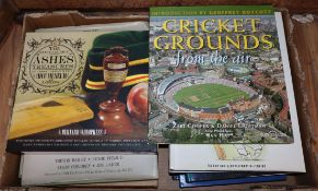 A collection of cricket books and Churchill original newspapers