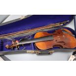 A 19th century European violin, cased with two bows