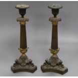 A pair of ormolu candlesticks height 30cm