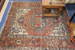 A Caucasian red ground rug 152 x 144cm