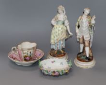 A pair of Dresden figures of a lady and gallant and a pink glazed cup and saucer and a dish