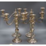 Two pairs of silver plated candelabra