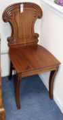 A pair of Regency mahogany hall chairs