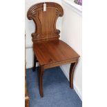 A pair of Regency mahogany hall chairs