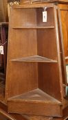 A pair of small oak corner units W.86cm