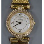 A ladys' 18ct gold wristwatch by Tanishq, India with diamond set bezel, on articulated bracelet (