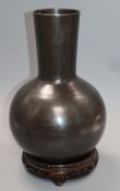 A Japanese bronze vase on associated hardwood stand height 32cm excluding stand