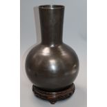 A Japanese bronze vase on associated hardwood stand height 32cm excluding stand