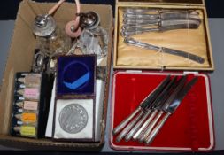 Two cased sets of six silver-handled butter knives and sundries, including a silver-topped condiment