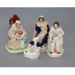 A Staffordshire figure of Queen Victoria, seated with baby and three other figures, comprising