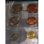 A collection of miscellaneous coins, including a Charles II gilded crown (modified as a brooch), a
