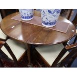 A George III mahogany oval drop leaf dining table 138cm extended