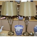 A pair of cut glass and brass lamps with shades