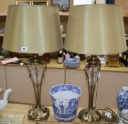 A pair of cut glass and brass lamps with shades