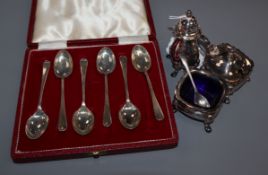 A three piece silver cruet set and five silver coffee spoons.