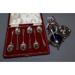 A three piece silver cruet set and five silver coffee spoons.