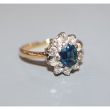 An 18ct gold,, sapphire and diamond oval cluster ring, size K.