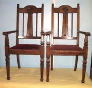 A pair of oak Art Nouveau elbow chairs