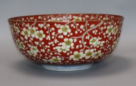 A Chinese bowl decorated with prunus on a scarlet ground, Chenghua mark diameter 32cm