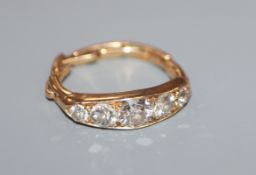 A yellow metal and diamond five stone ring, now with expandable watch strap? shank, stamped 18ct.