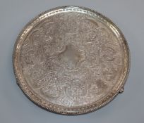 A George III silver salver, by Crouch & Hannam, London, 1777, with later embossed decoration, on