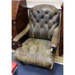 A late Victorian library chair upholstered in green leather