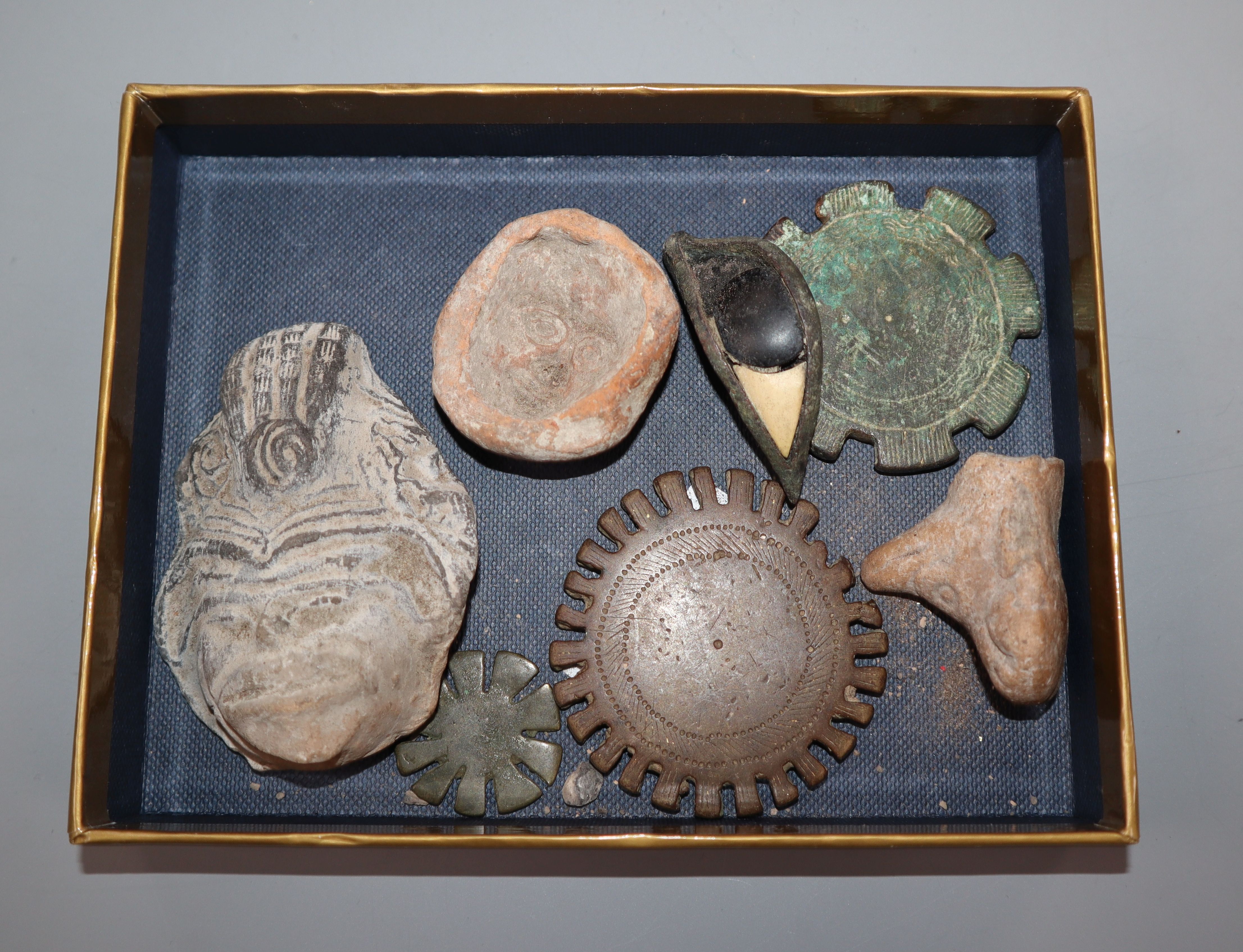 A bronze and stone Egyptian eye and other artefactsProvenance - from the family of a Victorian