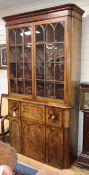 A George IV mahogany secretaire bookcase (altered) W.124cm