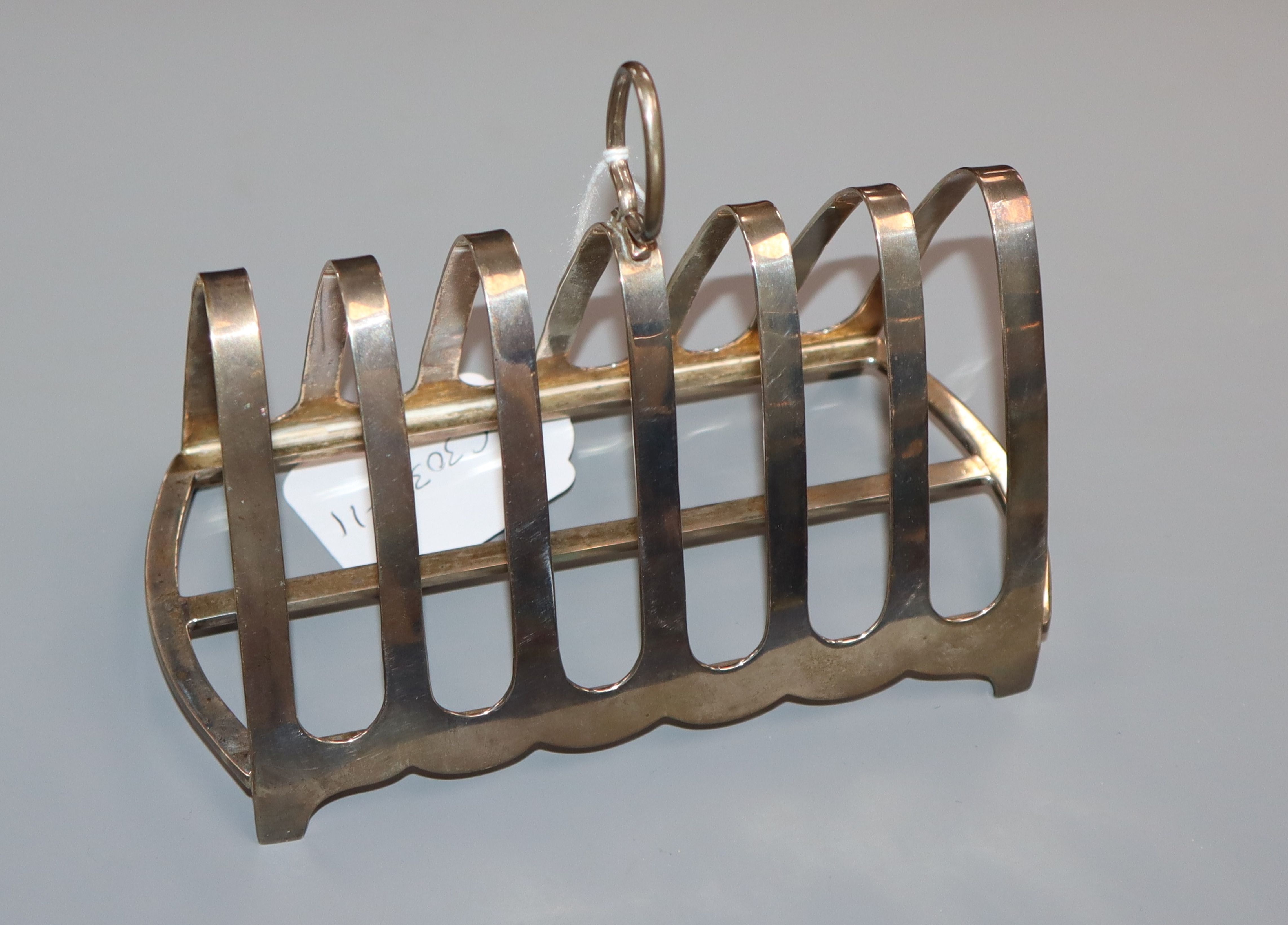 A George V seven bar silver toastrack, Birmingham, 1922, length 16cm, 6.5 oz.