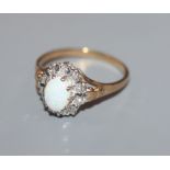 A 9ct gold, white opal and illusion set diamond ring, size P.