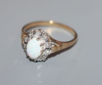 A 9ct gold, white opal and illusion set diamond ring, size P.