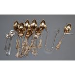 A set of twelve sterling coffee spoons, two silver condiment spoons and a pair of silver sugar