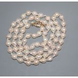 A modern single strand cultured baroque pearl necklace, with 9ct gold and diamond chip set clasp,