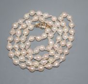 A modern single strand cultured baroque pearl necklace, with 9ct gold and diamond chip set clasp,