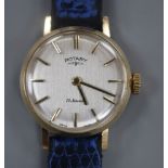A lady's 9ct gold Rotary manual wind wrist watch, on associated blue leather strap.