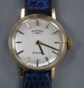 A lady's 9ct gold Rotary manual wind wrist watch, on associated blue leather strap.