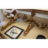 A pair of three branch gilt lion decorated sconces height 56cm