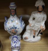 A French faience pilgrim flask, a delft figure, a Staffordshire figure and Victorian chamberpot