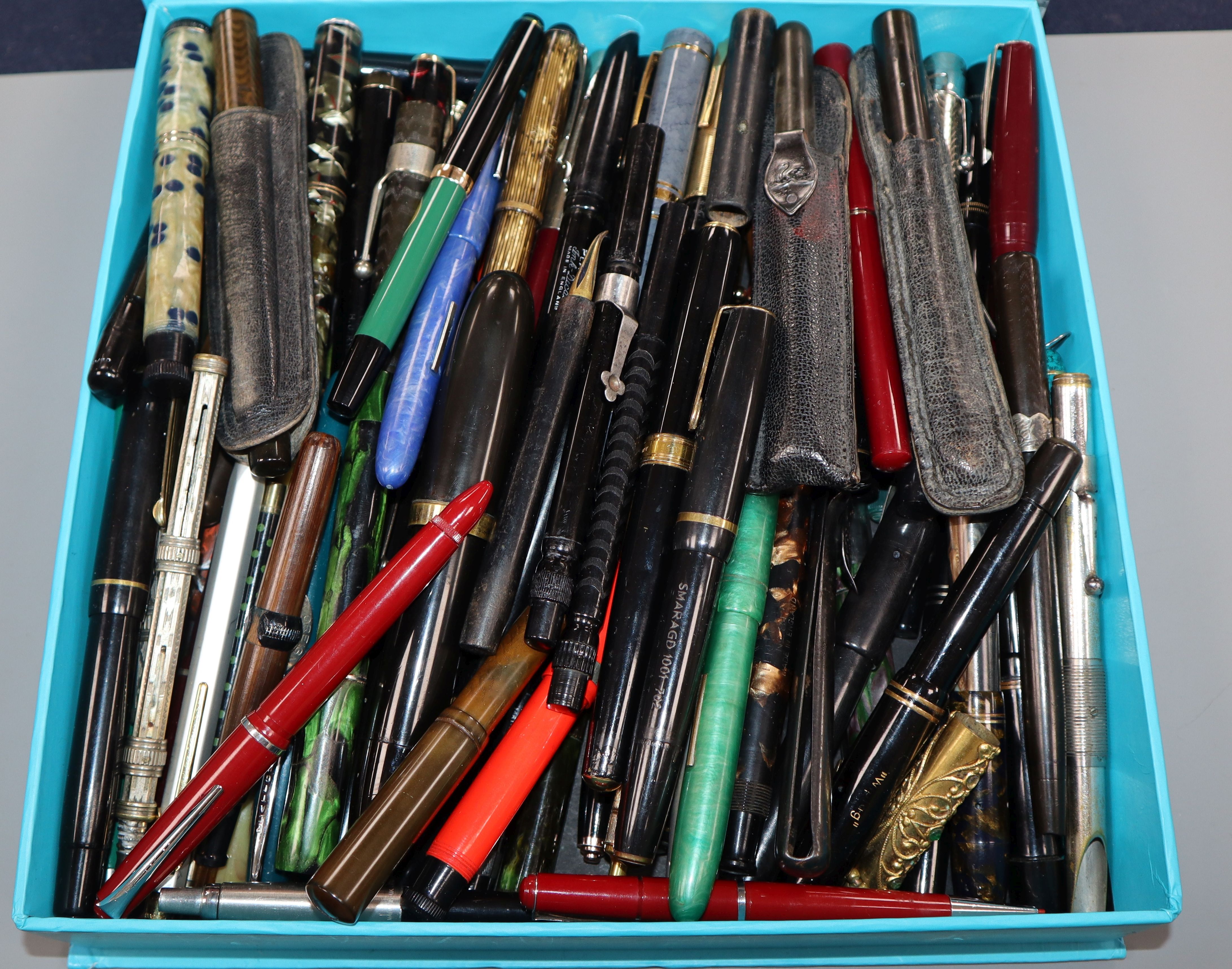 A large collection of vintage fountain pens, various makes