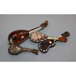 Four Italian tortoiseshell and mother of pearl models of mandolins and guitars