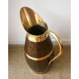 An oak and brass jug stick stand height 66cm