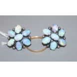 A pair of white metal and white opal cluster floral earrings and a small 22 ct gold band.
