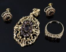 A modern Victorian style suite of 9ct and garnet set jewellery, comprising a ring, pendant and